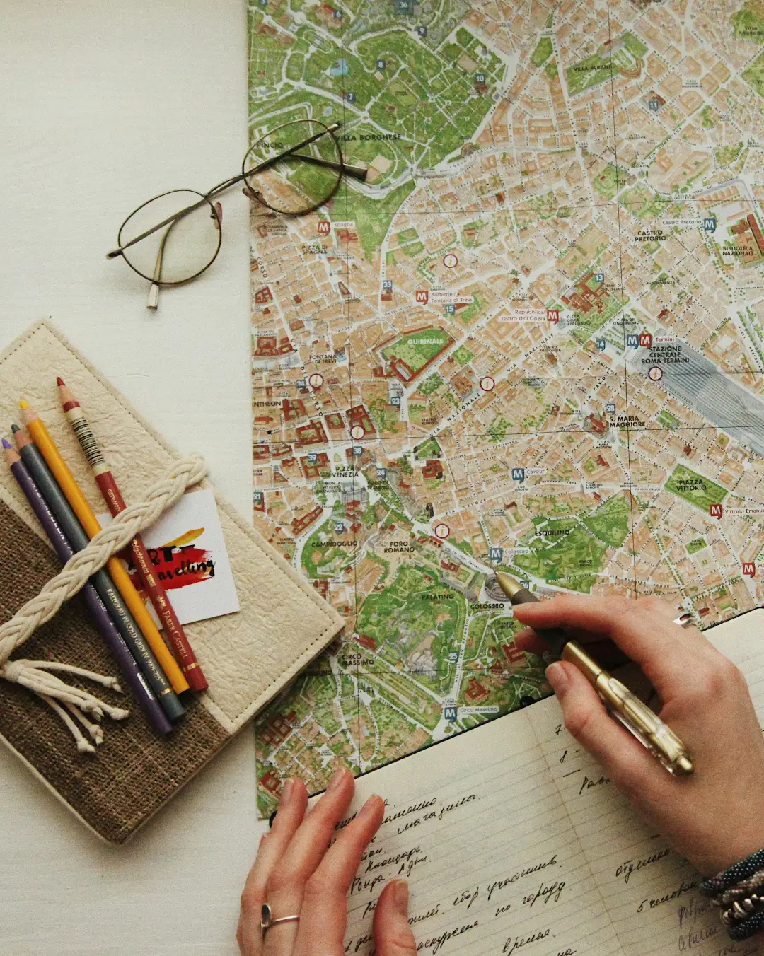 planning trip using map and notebook